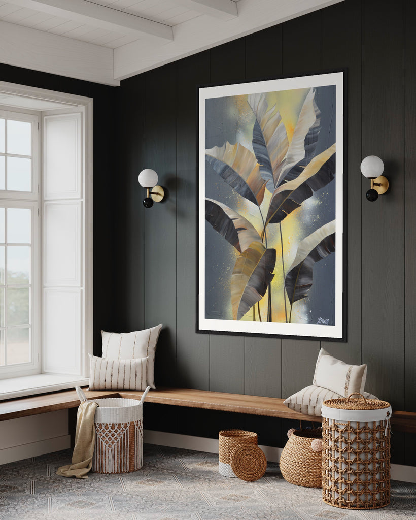 'Bittersweet' Fine Art Print by Jasmine Marshall, framed in black/oak. Premium Giclée print features grey palm leaves on an abstract yellow background. Featured in a neutral home interior with grey walls.