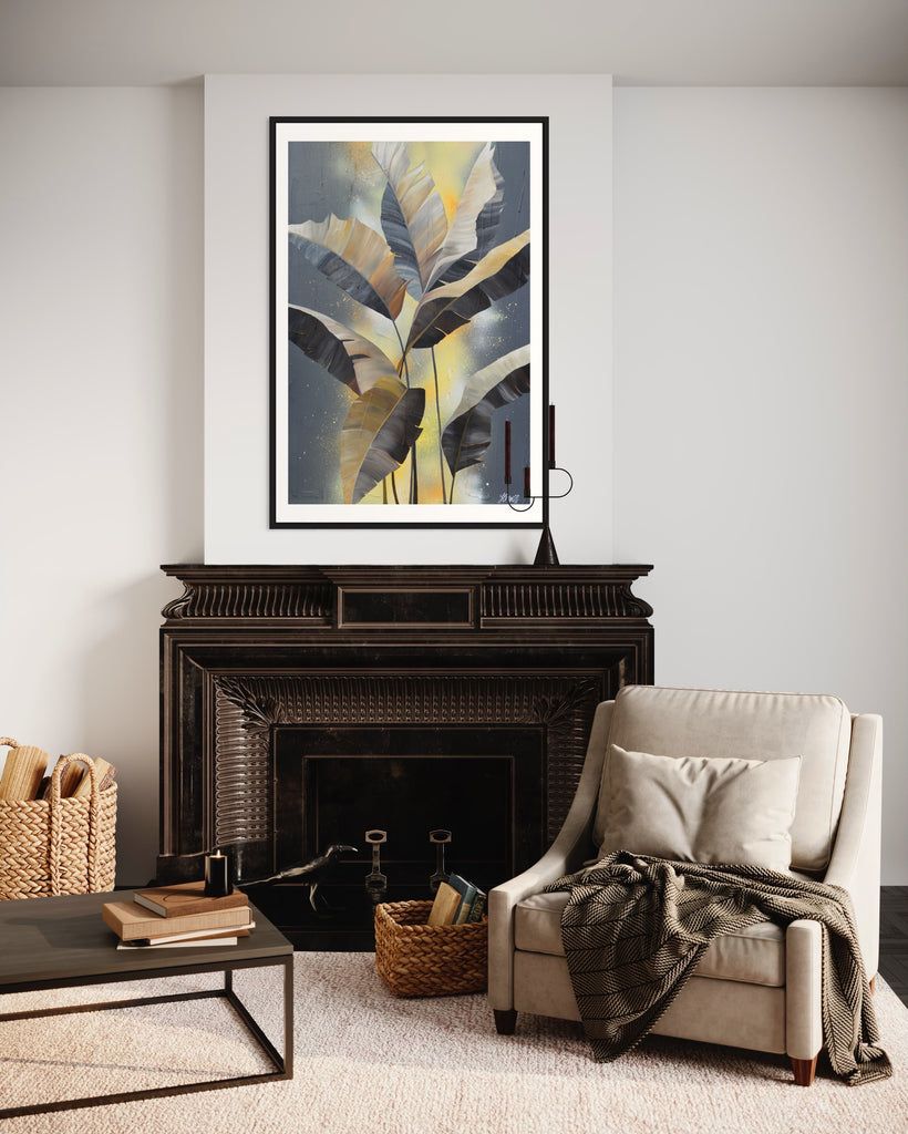 'Bittersweet' Fine Art Print by Jasmine Marshall, framed in black/oak. Premium Giclée print features grey palm leaves on an abstract yellow background. Featured in a neutral home interior over a fireplace.