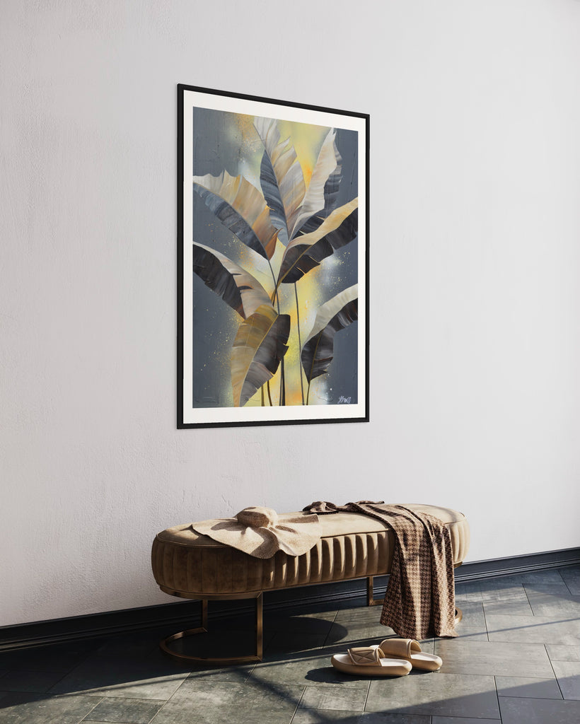 'Bittersweet' Fine Art Print by Jasmine Marshall, framed in black/oak. Premium Giclée print features grey palm leaves on an abstract yellow background. Featured in a neutral home interior.