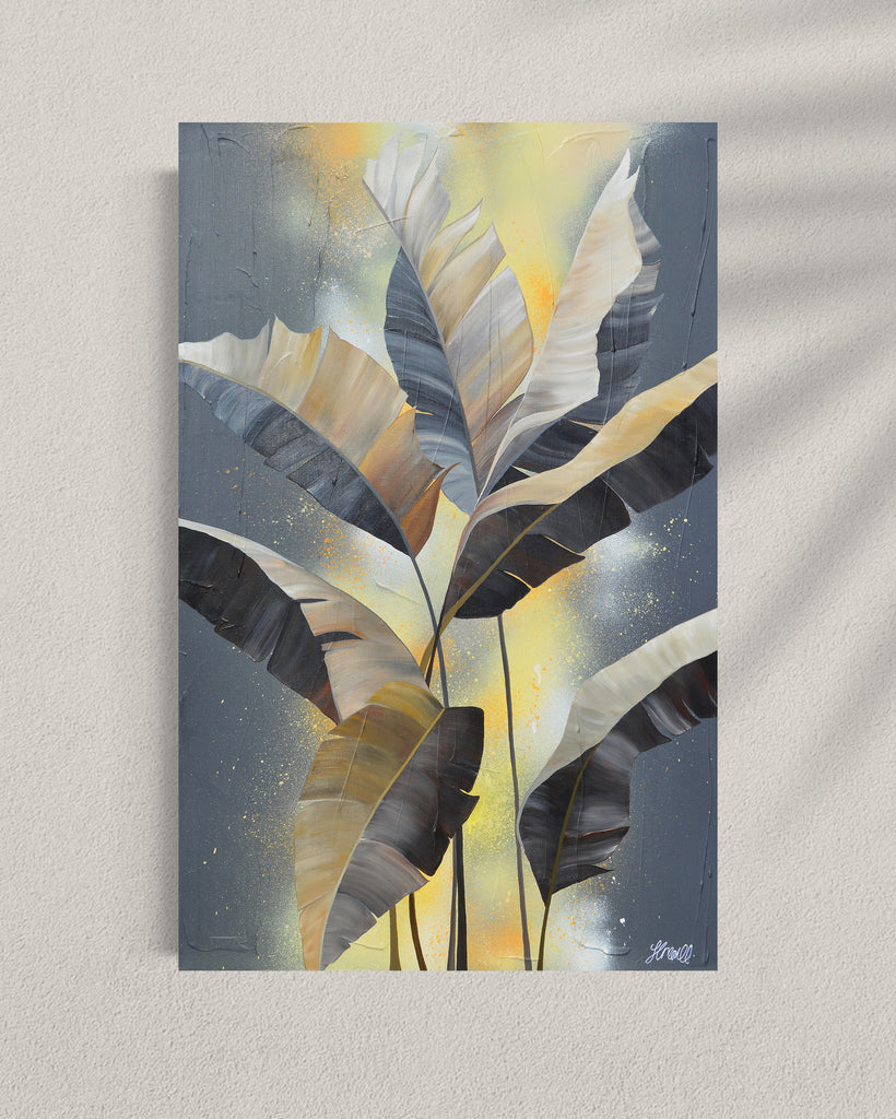 'Bittersweet' original acrylic painting by Jasmine Marshall framed in black/oak. Canvas painting features grey palm leaves on an abstract yellow background. Featured in a gallery.