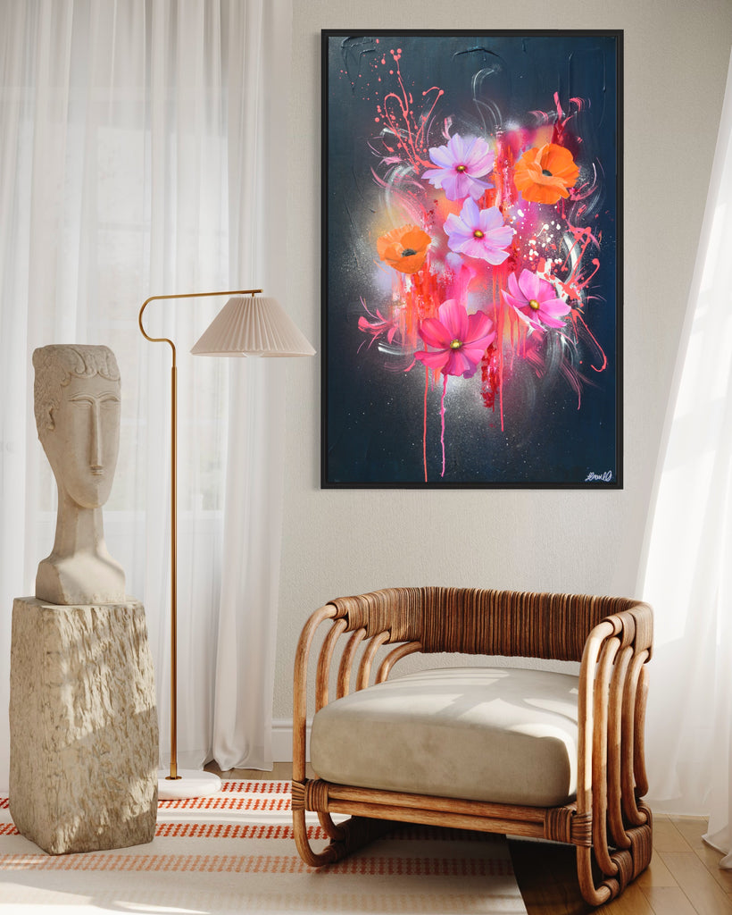 'Drama Tropicana' original painting on a cotton canvas by Jasmine Marshall, framed in black/oak. Features orange poppies and pink and purple flower on an abstract navy background and neon pink, featured in a neutral home interior. with wooden chair and white curtains.