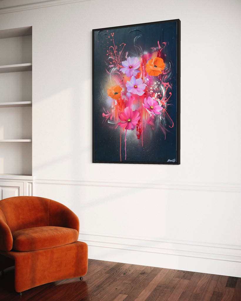 'Drama Tropicana' original painting on a cotton canvas by Jasmine Marshall, framed in black/oak. Features orange poppies and pink and purple flower on an abstract navy background and neon pink, featured in a neutral home interior. with orange velvet chair.