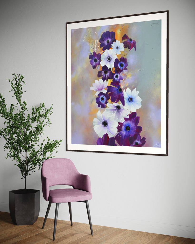 ‘Flourish' Fine Art Print by Jasmine Marshall, framed in black/oak. Premium Giclée print features white and purple anemone flowers on a grey and lilac abstract background, featured in a neutral home interior with a purple chair and plant.