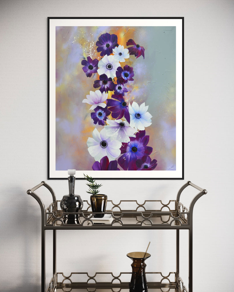 ‘Flourish' Fine Art Print by Jasmine Marshall, framed in black/oak. Premium Giclée print features white and purple anemone flowers on a grey and lilac abstract background, featured in a neutral home interior with a mirror bar cart.