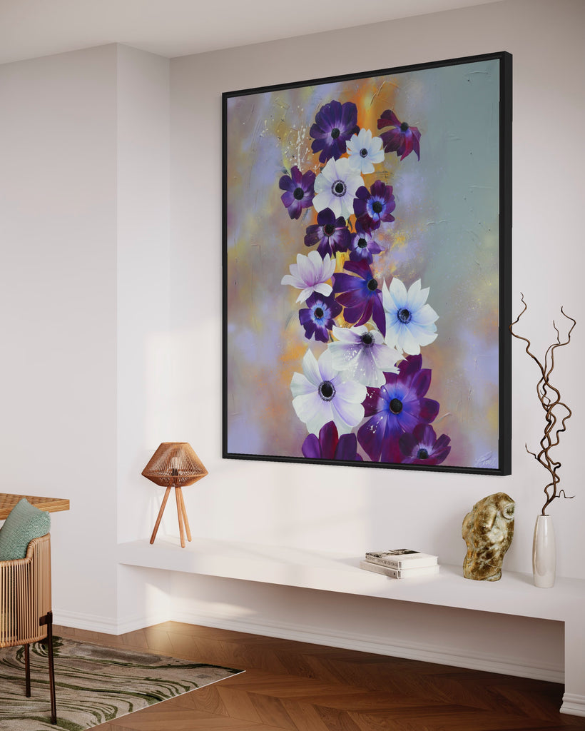 'Flourish' original painting on a cotton canvas by Jasmine Marshall, framed in black/oak. Features white and purple anemone flowers on a grey and lilac abstract background, featured in a neutral home interior.