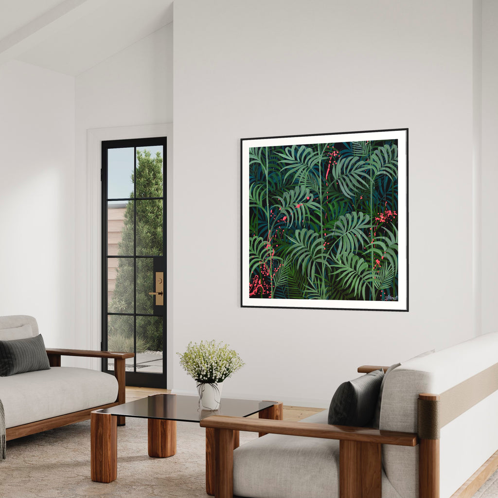 'Forever Green' fine art print by Jasmine Marshall framed in black, featured in a white living room with glass doors overlooking the garden