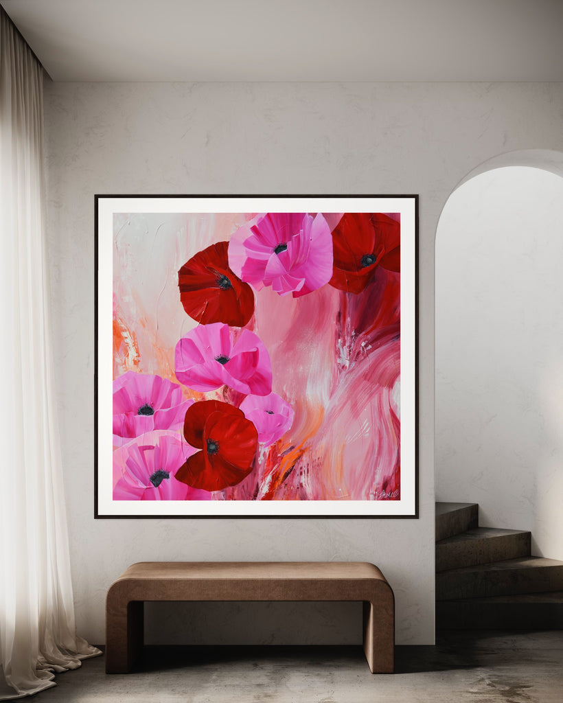 ‘It’s a Forever Thing' Fine Art Print by Jasmine Marshall, framed in black/oak. Premium Giclée print features pink and red poppies on an abstract background with pops of orange.  Displayed in a neutral home interior.