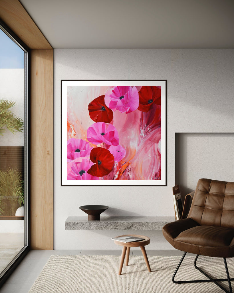 ‘It’s a Forever Thing' Fine Art Print by Jasmine Marshall, framed in black/oak. Premium Giclée print features pink and red poppies on an abstract background with pops of orange.  Displayed in a neutral home interior with views of the garden.