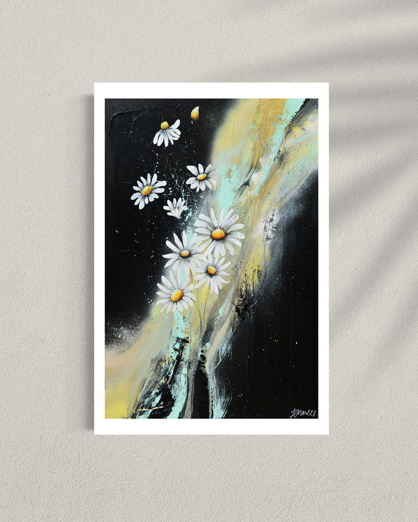 ‘Light in the Darkness' Fine Art Print by Jasmine Marshall, framed in black/oak. Premium Giclée print features white daisies on a black abstract background.  Displayed in a gallery.