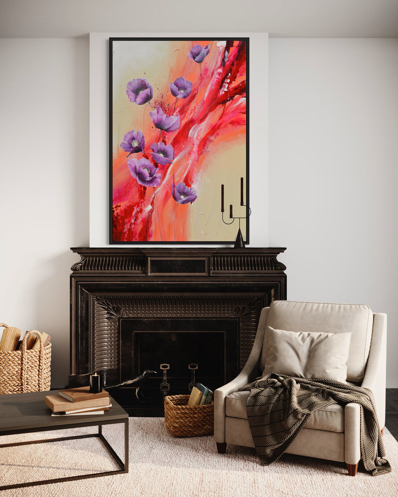 'Making Memories' original painting on a cotton canvas by Jasmine Marshall, framed in black/oak. Features purple poppies on a cream and red abstract background. Displayed in a neutral home interior with a black fireplace and cream chair.