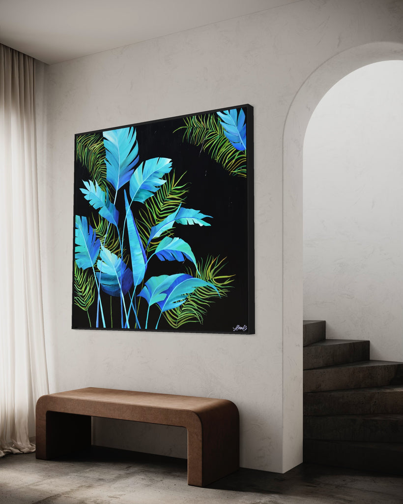 'Midnight Jungle' original painting on a cotton canvas by Jasmine Marshall, framed in black/oak. Features turquoise palm leaves on a black background. Displayed in a neutral home interior.