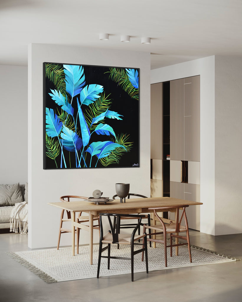 'Midnight Jungle' original painting on a cotton canvas by Jasmine Marshall, framed in black/oak. Features turquoise palm leaves on a black background. Displayed in a neutral kitchnen.