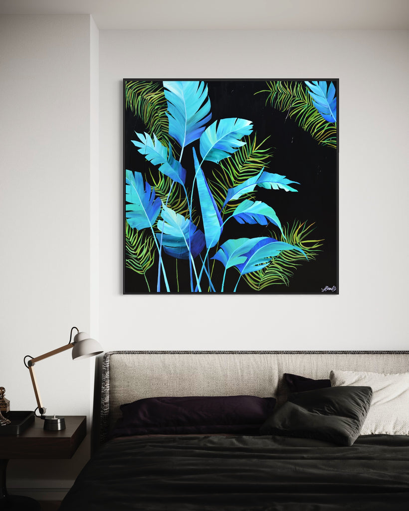 'Midnight Jungle' original painting on a cotton canvas by Jasmine Marshall, framed in black/oak. Features turquoise palm leaves on a black background. Displayed above a black bed.