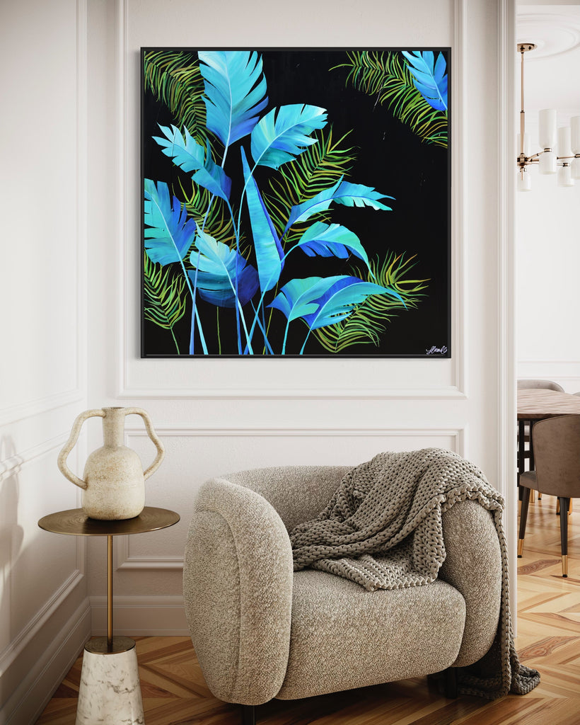 'Midnight Jungle' original painting on a cotton canvas by Jasmine Marshall, framed in black/oak. Features turquoise palm leaves on a black background. Displayed in a neutral home interior.