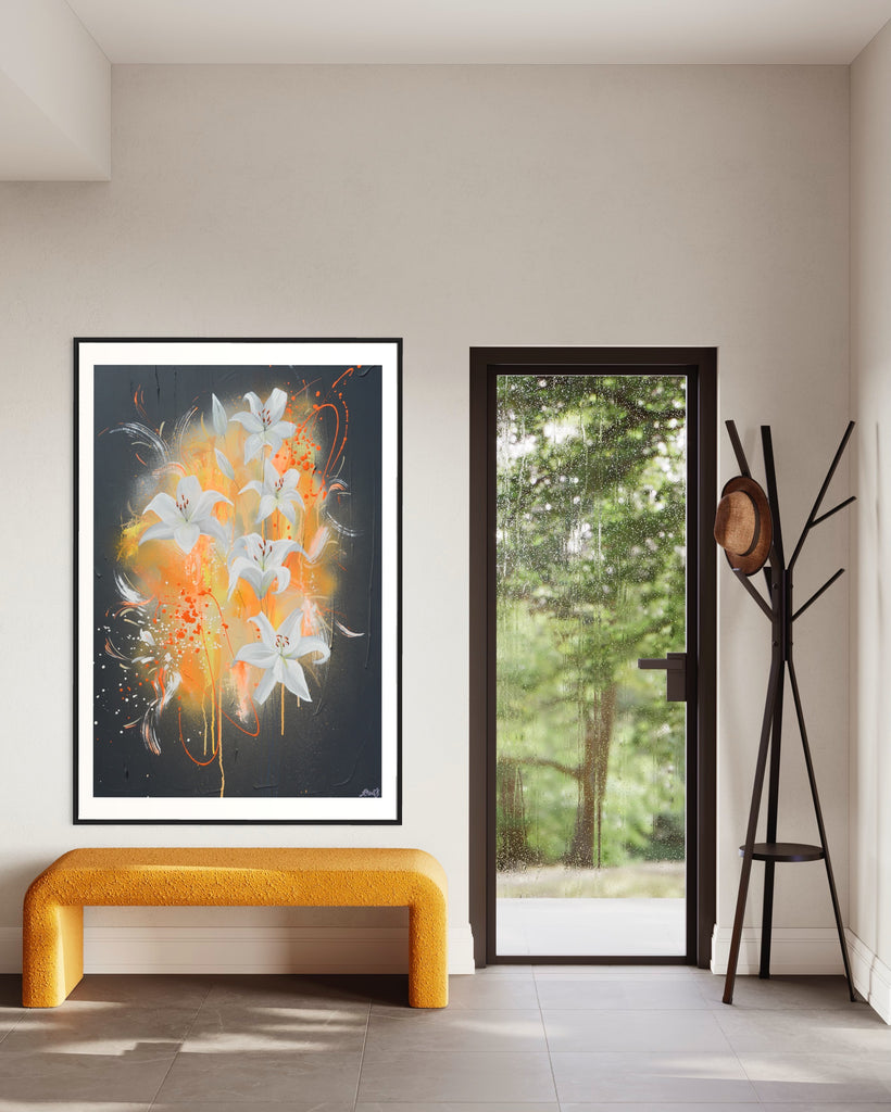 ‘Sweet Pollen' Fine Art Print by Jasmine Marshall, framed in black/oak. Premium Giclée print features white lilies on a grey textured background with pops of neon orange. Displayed above a yellow bench and black coat stand.