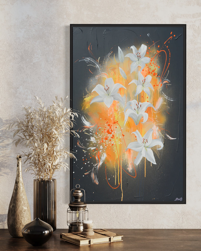 'Sweet Pollen' original painting on a cotton canvas by Jasmine Marshall, framed in black/oak. Features white lilies on a grey textured background with pops of neon orange. Displayed in a neutral home interior above a wooden shelf with dried flowers on.