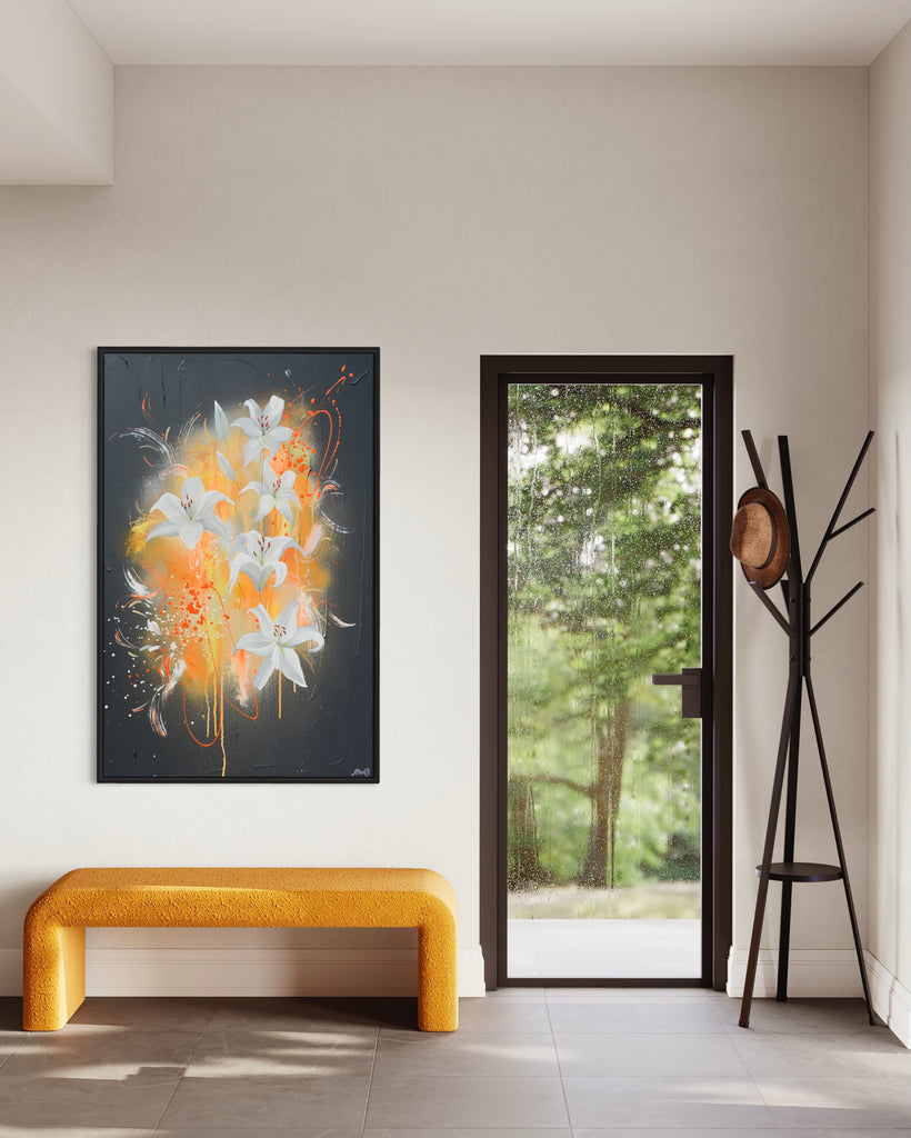 'Sweet Pollen' original painting on a cotton canvas by Jasmine Marshall, framed in black/oak. Features white lilies on a grey textured background with pops of neon orange. Displayed above a yellow bench.