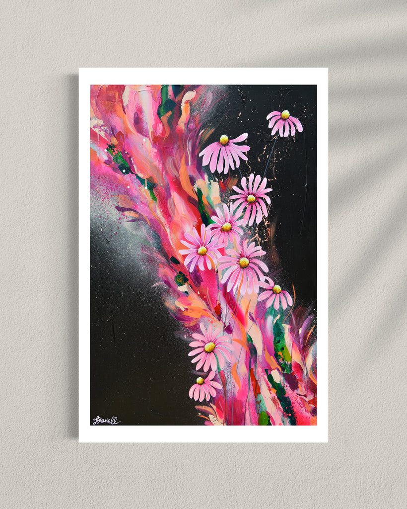 ‘The Laughter of Daisies' Fine Art Print by Jasmine Marshall, framed in black/oak. Premium Giclée print features pink daises on a colourful abstract details on a black background. Displayed in a gallery.