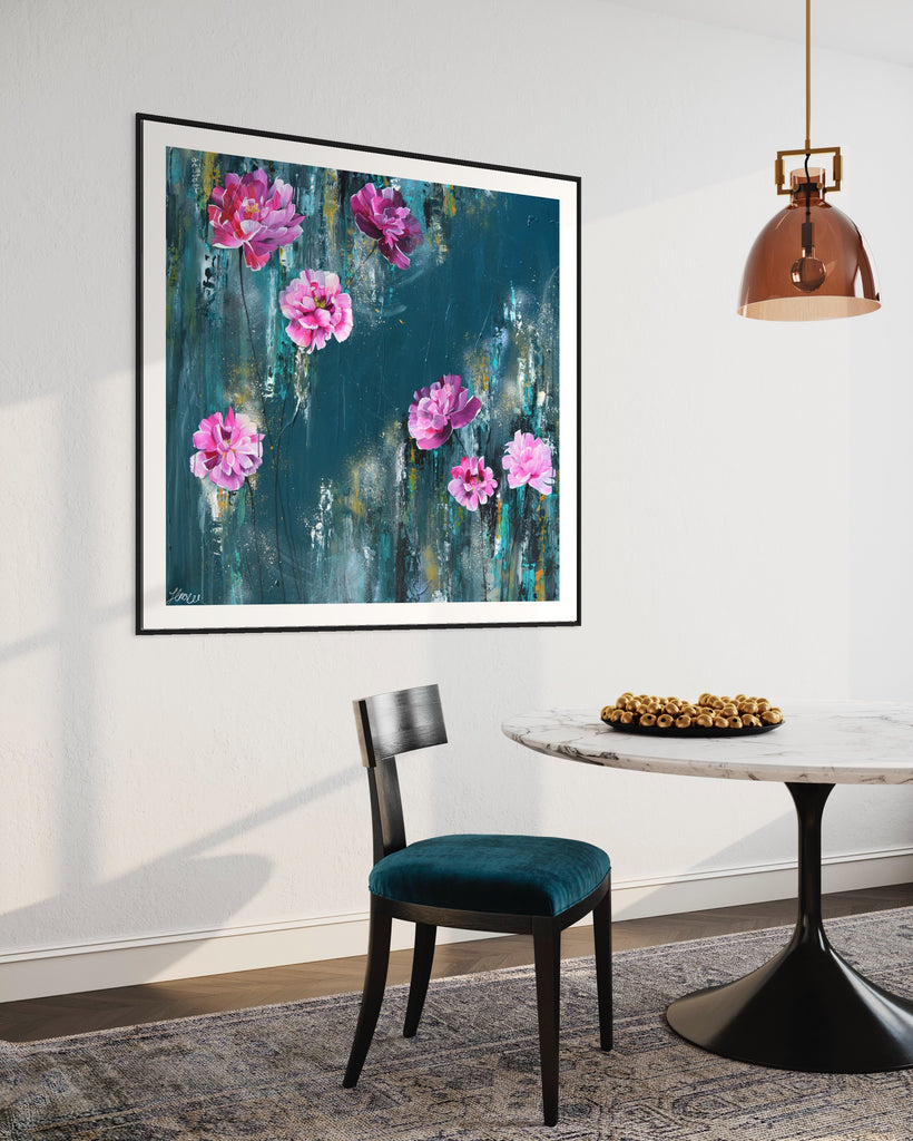 ‘The Other Side' Fine Art Print by Jasmine Marshall, framed in black/oak. Premium Giclée print features pink peonies on a teal background. Displayed in a neutral home interior with rose gold hanging lamp, marble table and teal chair.