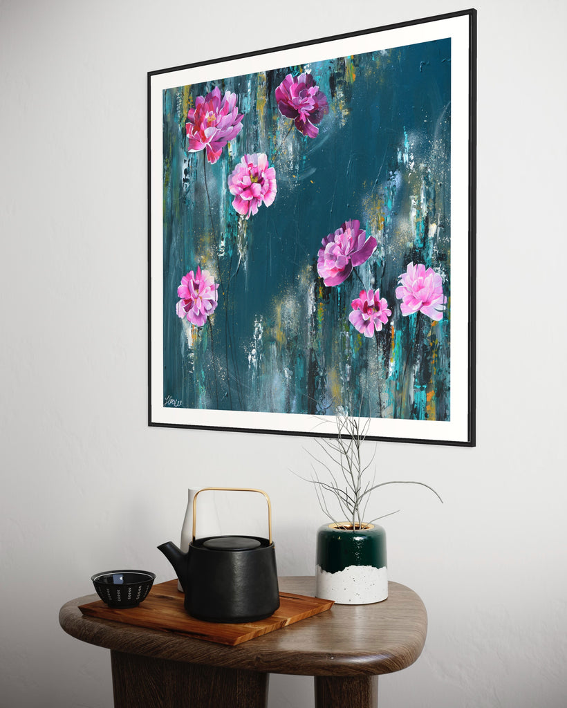 ‘The Other Side' Fine Art Print by Jasmine Marshall, framed in black/oak. Premium Giclée print features pink peonies on a teal background. Displayed in a neutral home interior.