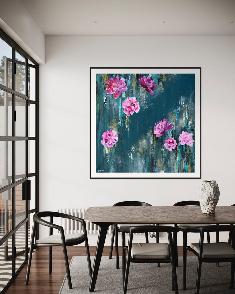 ‘The Other Side' Fine Art Print by Jasmine Marshall, framed in black/oak. Premium Giclée print features pink peonies on a teal background. Displayed in a dining room with black table and big glass door.