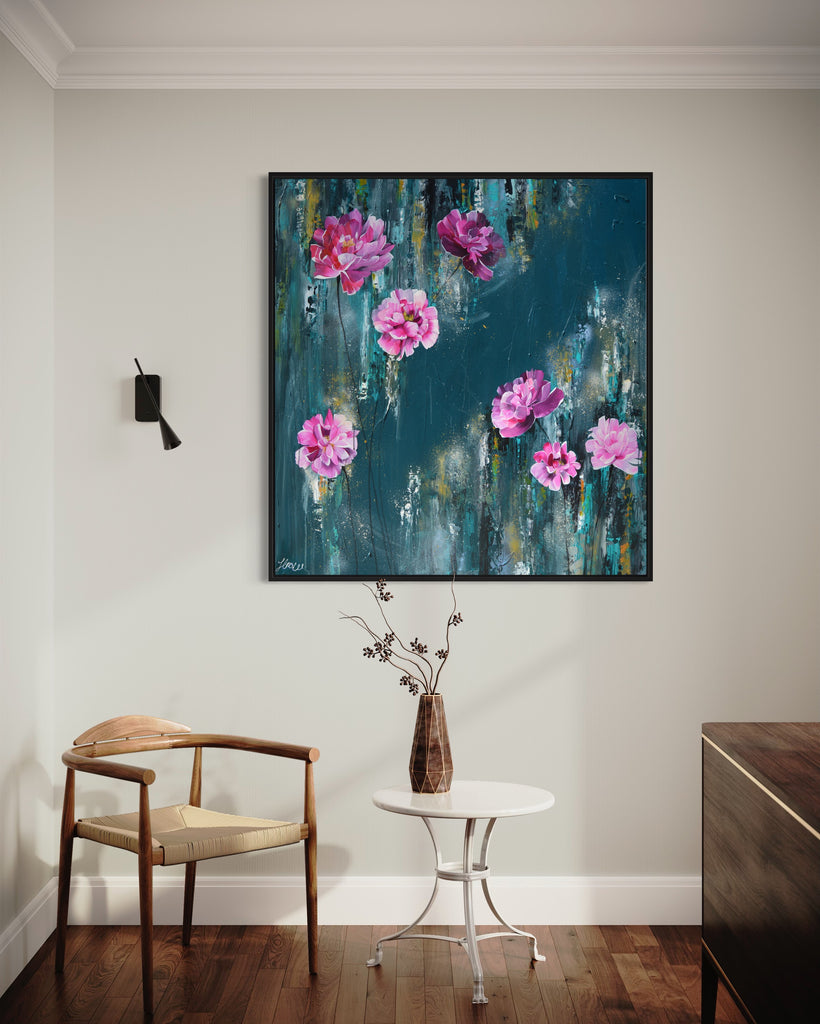 'The Other Side' original painting on a cotton canvas by Jasmine Marshall, framed in black/oak. Features pink peonies on a teal background. Displayed in a neutral home interior.