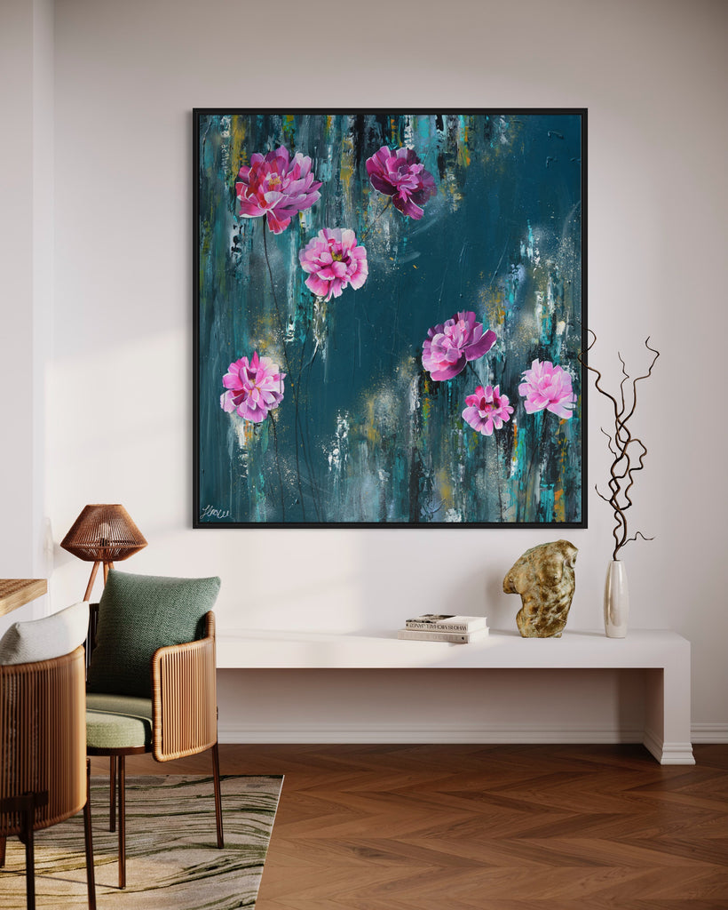 'The Other Side' original painting on a cotton canvas by Jasmine Marshall, framed in black/oak. Features pink peonies on a teal background. Displayed in a neutral home interior.