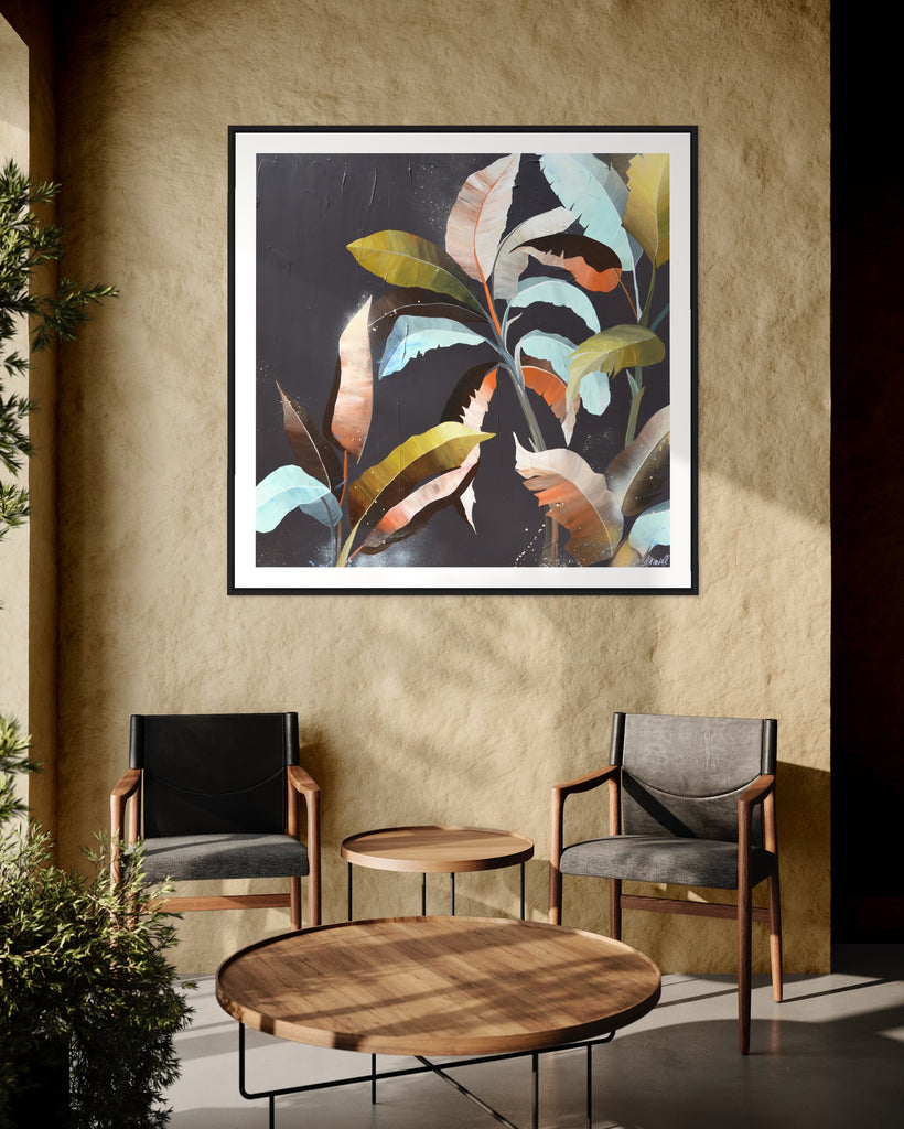 ‘Under the Canopy' Fine Art Print by Jasmine Marshall, framed in black/oak. Premium Giclée print features a palm tree on a brown background with abstract details. Displayed in a neutral home interior with chairs, wooden table and a plant.