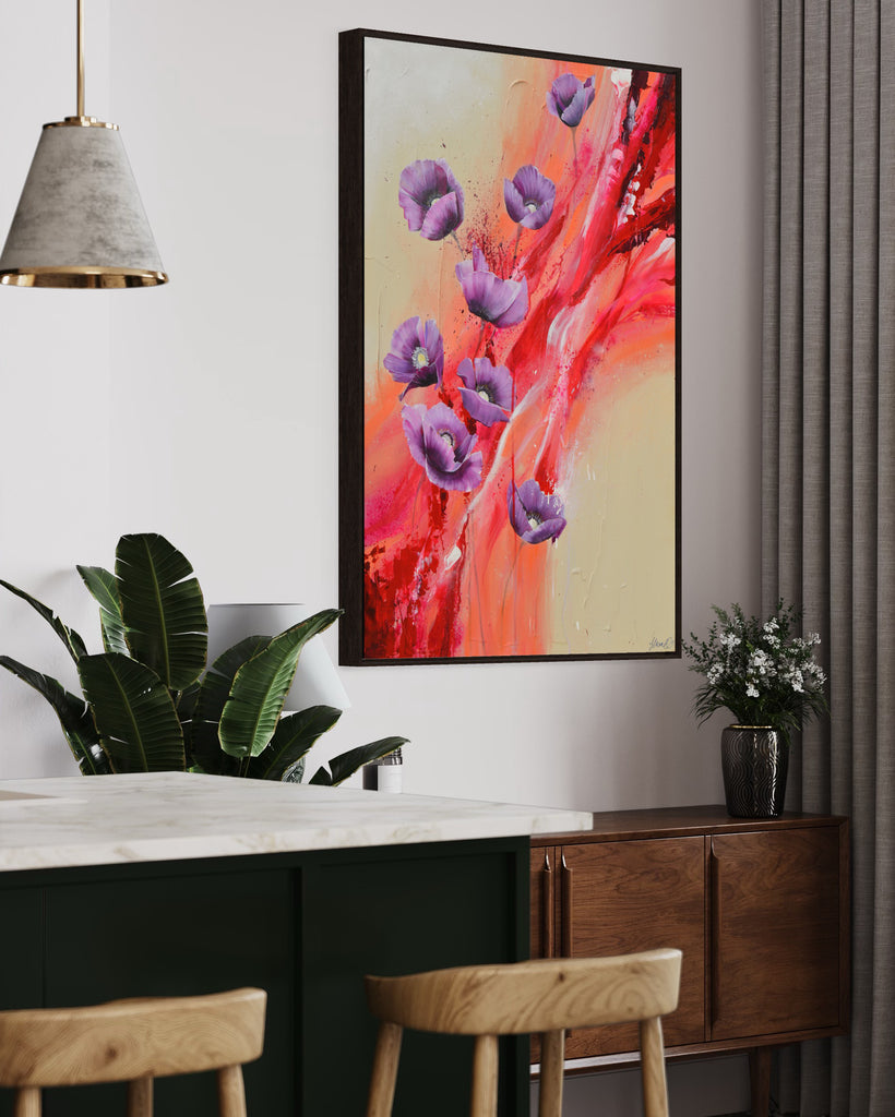 'Making Memories' original painting on a cotton canvas by Jasmine Marshall, framed in black/oak. Features purple poppies on a cream and red abstract background. Displayed in a green kitchen with plants and wood.