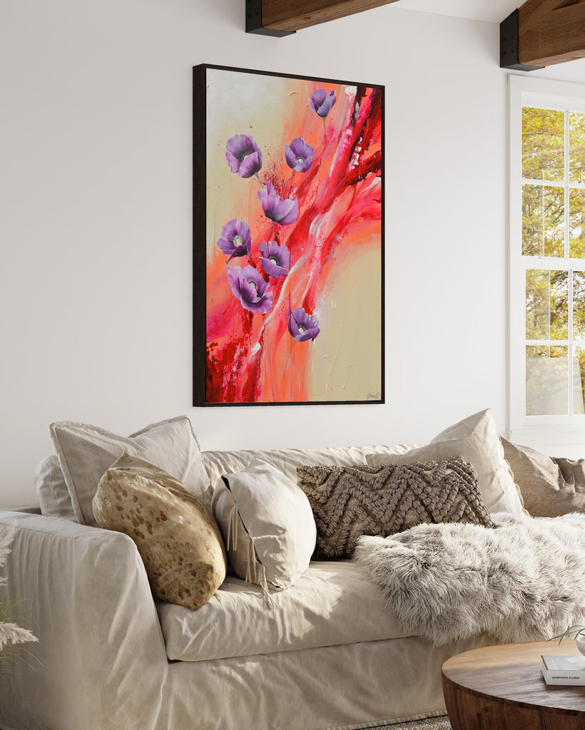 'Making Memories' original painting on a cotton canvas by Jasmine Marshall, framed in black/oak. Features purple poppies on a cream and red abstract background. Displayed in a neutral home interior., wooden ceiling beams, white sofa and textured cushions.