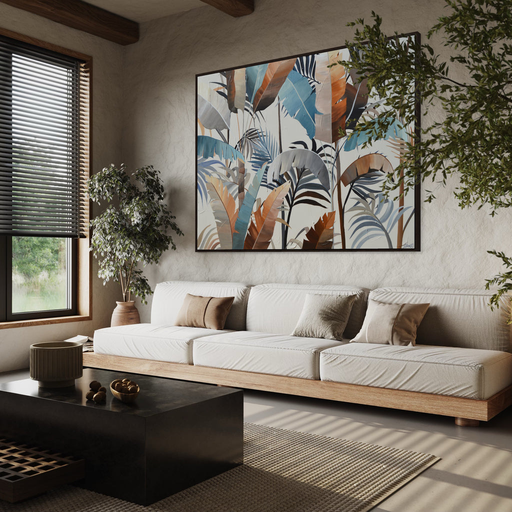 'Virgin Forest' original painting by Jasmine Marshall Art of tropical neutral leaves in a living room with beige sofas.