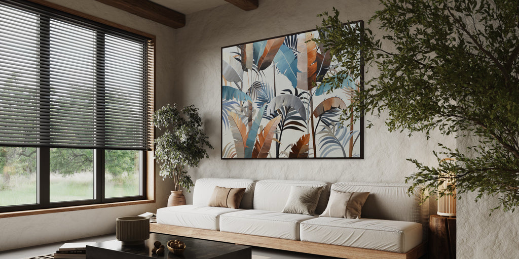 'Virgin Forest' original painting by Jasmine Marshall Art of tropical neutral leaves in a living room with beige sofas.