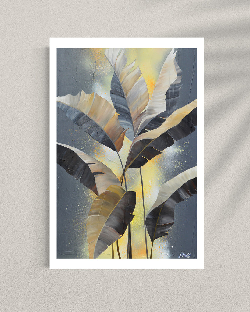 'Bittersweet' Fine Art Print by Jasmine Marshall, framed in black/oak. Premium Giclée print features grey palm leaves on an abstract yellow background. Featured in a gallery.